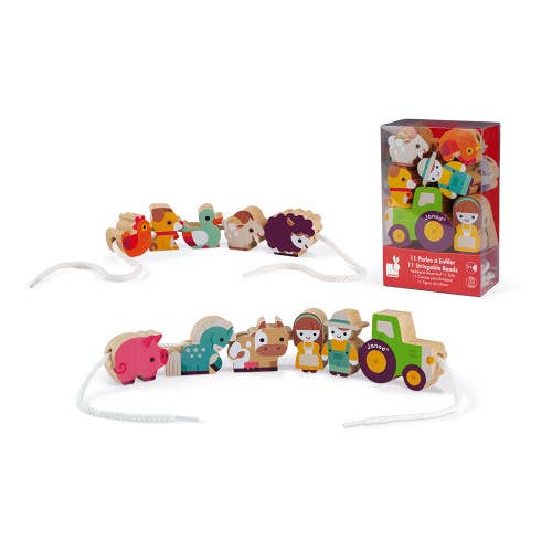 A set of stringable farm-themed beads and strings, displayed alongside a closed box with more beads inside.