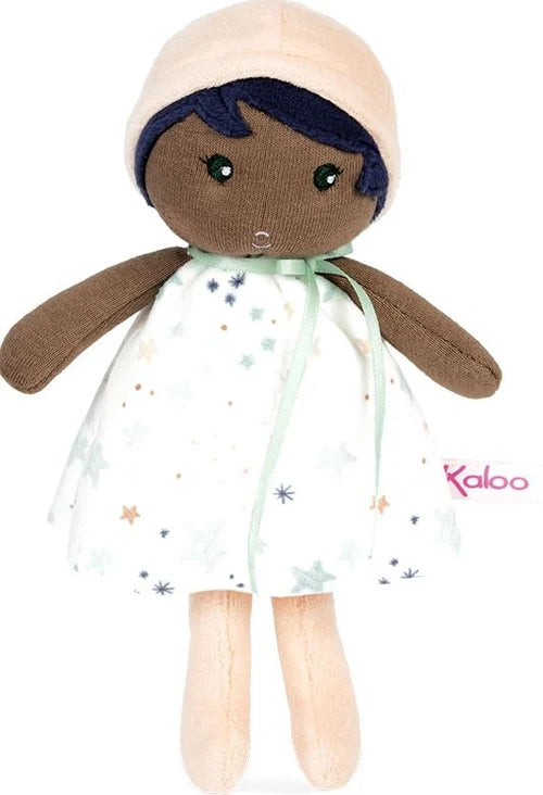A small doll in a hat and light blue dress.
