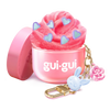Gui Gui Mini Cloud Slime open pink jar with fluffy pink slime decorated with blue hearts and bunny and flower keychain charms