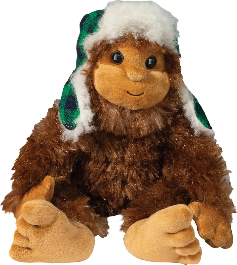 Douglas Co. Sasquatch soft brown plush stuffed animal wearing a fleece bomber hat, with floppy posable arms and legs, seated 6 inches tall